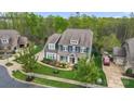 Aerial view showcasing the home, landscaping, and surrounding neighborhood at 13713 Sunset Bluffs Cir, Huntersville, NC 28078