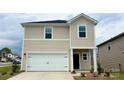 Charming two-story home showcasing a white garage door, neutral siding, and beautifully landscaped front yard at 141 Shepherds Landing Dr, Mooresville, NC 28115