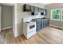 Functional kitchen boasts updated cabinets, modern appliances, and durable wood flooring at 2210 22Nd Avenue Se Ct, Hickory, NC 28602
