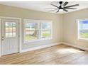 Bright living room featuring hardwood floors, neutral paint, and a modern ceiling fan at 2210 22Nd Avenue Se Ct, Hickory, NC 28602