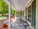 Inviting front porch with rocking chairs, offering a relaxing outdoor space with great natural light at 2248 Lawton Bluff Rd, Charlotte, NC 28226