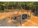 Carport area with black SUV and wooden beam structure at 2710 Wyatt Grove Church Rd, Richfield, NC 28137