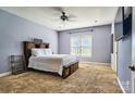 Serene bedroom with a large window, plush carpet, and ample space for relaxation at 28926 Hartsell Rd, Albemarle, NC 28001