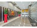 Modern lobby featuring sleek design elements, recessed lighting and vibrant artwork at 333 W Trade St # 1802, Charlotte, NC 28202