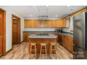 Functional kitchen with an island cooktop, ample cabinetry, and an adjacent dining area at 3720 Lanes Creek Rd, Marshville, NC 28103