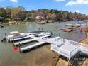 Lakefront dock with multiple boat slips, offering easy access to water activities and scenic views at 4098 Kiser Cove Ln, Terrell, NC 28682