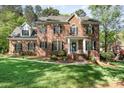 Beautiful brick home with a manicured lawn and stately entrance at 4511 Morning Dove Ct, Denver, NC 28037