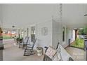Relaxing covered porch featuring rocking chairs and porch swing at 481 Union Cemetery Sw Rd, Concord, NC 28027