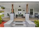Inviting porch entrance with brick steps and wooden support beams at 481 Union Cemetery Sw Rd, Concord, NC 28027