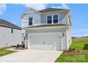 A bright two-story home with attached garage and concrete driveway at 5016 Poplin Vly, Cherryville, NC 28021