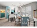 Cozy dining area with a round table, bright window, and stylish blue accents at 969 Copperstone Ln, Fort Mill, SC 29708