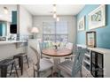 Bright dining area with a wooden table, stylish chairs, and natural light from the window at 969 Copperstone Ln, Fort Mill, SC 29708