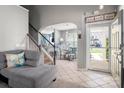 Inviting entryway with tile flooring, stairs, and a view of the dining area at 969 Copperstone Ln, Fort Mill, SC 29708