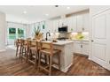 Stylish kitchen featuring a large island with barstool seating and pendant lighting at 1046 Mapletree Ln, Indian Trail, NC 28079