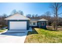 Inviting single-story home with a convenient two-car garage, surrounded by a lush green lawn at 1314 39Th Street Sw Cir, Hickory, NC 28602