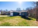 Inviting blue home with white trim, set on a lush green lawn in a tranquil, wooded neighborhood at 1314 39Th Street Sw Cir, Hickory, NC 28602