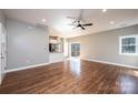 Spacious living room featuring hardwood floors, recessed lighting, and access to the kitchen and outdoor deck at 1314 39Th Street Sw Cir, Hickory, NC 28602