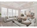 Spacious living room features coffered ceilings and large windows allowing for plenty of natural light at 1378 Cedardale Ln, Denver, NC 28037