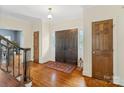 Inviting foyer with hardwood floors, a staircase, and a striking double-door entrance for a grand welcome at 1736 Cavendale Dr, Rock Hill, SC 29732