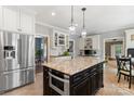 Spacious kitchen features a large island, stainless steel appliances, and custom cabinets for modern functionality at 1736 Cavendale Dr, Rock Hill, SC 29732