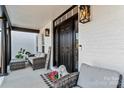 Cozy front porch featuring comfortable seating and decorative details at 1840 Sapona Ct, Denver, NC 28037