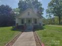 Inviting one-story house featuring a covered front porch and sidewalk at 224 Mcclain St, York, SC 29745