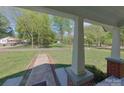 View from the porch overlooking the green front yard and quiet street at 224 Mcclain St, York, SC 29745
