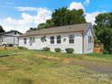 A charming ranch style home with a well-kept lawn and tidy landscaping at 2633 N Sharon Amity Rd, Charlotte, NC 28205