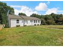 Charming single-story home featuring a well-manicured lawn and tidy landscaping at 2633 N Sharon Amity Rd, Charlotte, NC 28205