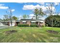 Traditional brick home with well-maintained lawn and landscaping, showcasing curb appeal and a cozy aesthetic at 3017 Lynwood Dr, Lancaster, SC 29720