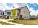 Well-maintained home featuring a two-car garage and nicely landscaped front yard at 3021 Patchwork Ct, Fort Mill, SC 29708