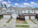 Charming townhomes feature brick accents, two-car garages, and well-maintained landscaping at 44455 Oriole Dr # 100, Indian Land, SC 29707