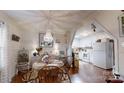 Charming dining room featuring a chandelier, hardwood floors, and view into the kitchen at 608 Forney Ave, Lincolnton, NC 28092