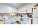 Bright kitchen with white cabinetry, modern appliances, and a clean, functional layout at 608 Forney Ave, Lincolnton, NC 28092