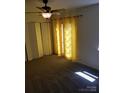 Cozy bedroom featuring a ceiling fan and ample closet space at 9156 Black Heath Cir, Charlotte, NC 28214