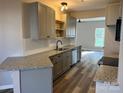 Beautiful kitchen with modern cabinets, granite countertops, and sleek appliances at 2006 Cramerton Village Dr # 31-D, Cramerton, NC 28032