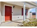 Inviting front porch featuring a red door and the house number, creating a warm and welcoming entrance at 213 Morton St, Shelby, NC 28152