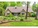 Charming brick home featuring a well-maintained lawn and manicured landscaping at 2470 Highway 557 Rd, Clover, SC 29710