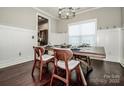 Bright dining room with hardwood floors and decorative wainscoting at 2676 Poplar Cove Nw Dr, Concord, NC 28027
