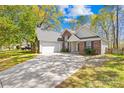 Traditional brick home with attached garage and long driveway at 3002 Enderbury Dr, Indian Trail, NC 28079