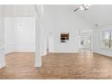 Spacious living room featuring wood floors, white walls and trim and lots of light at 3002 Enderbury Dr, Indian Trail, NC 28079