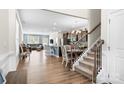 Open-concept living space with hardwood floors, dining area, and staircase, perfect for modern living at 4112 Steel Way, Sherrills Ford, NC 28673