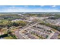Expansive aerial view of a well-planned community with a lake, showcasing the neighborhood layout at 7850 Fountaingrass Ln, Sherrills Ford, NC 28673