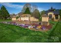 Community entrance with stone sign and manicured landscaping at 819 Beauhaven Ln, Waxhaw, NC 28173