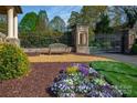 Gated entrance with brick columns and decorative wrought iron at 819 Beauhaven Ln, Waxhaw, NC 28173