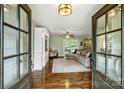 Inviting living room with hardwood floors, a comfortable sectional, and doors opening to the backyard at 9025 Shields Dr, Huntersville, NC 28078