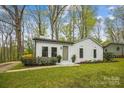 Charming white brick home with a well-manicured lawn and lush landscaping at 1162 Westover Cir, Rock Hill, SC 29732