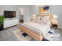 Stylishly staged bedroom with a minimalist design, featuring a comfortable bed and ample natural light at 1235 Culver Spring Way, Charlotte, NC 28215
