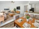 Open-concept living area with modern furnishings, recessed lighting, and seamless flow to the dining and kitchen spaces at 1235 Culver Spring Way, Charlotte, NC 28215