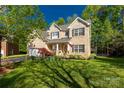 Beautiful two-story brick home with well-maintained lawn and mature trees at 206 Coburn Ct, Fort Mill, SC 29715